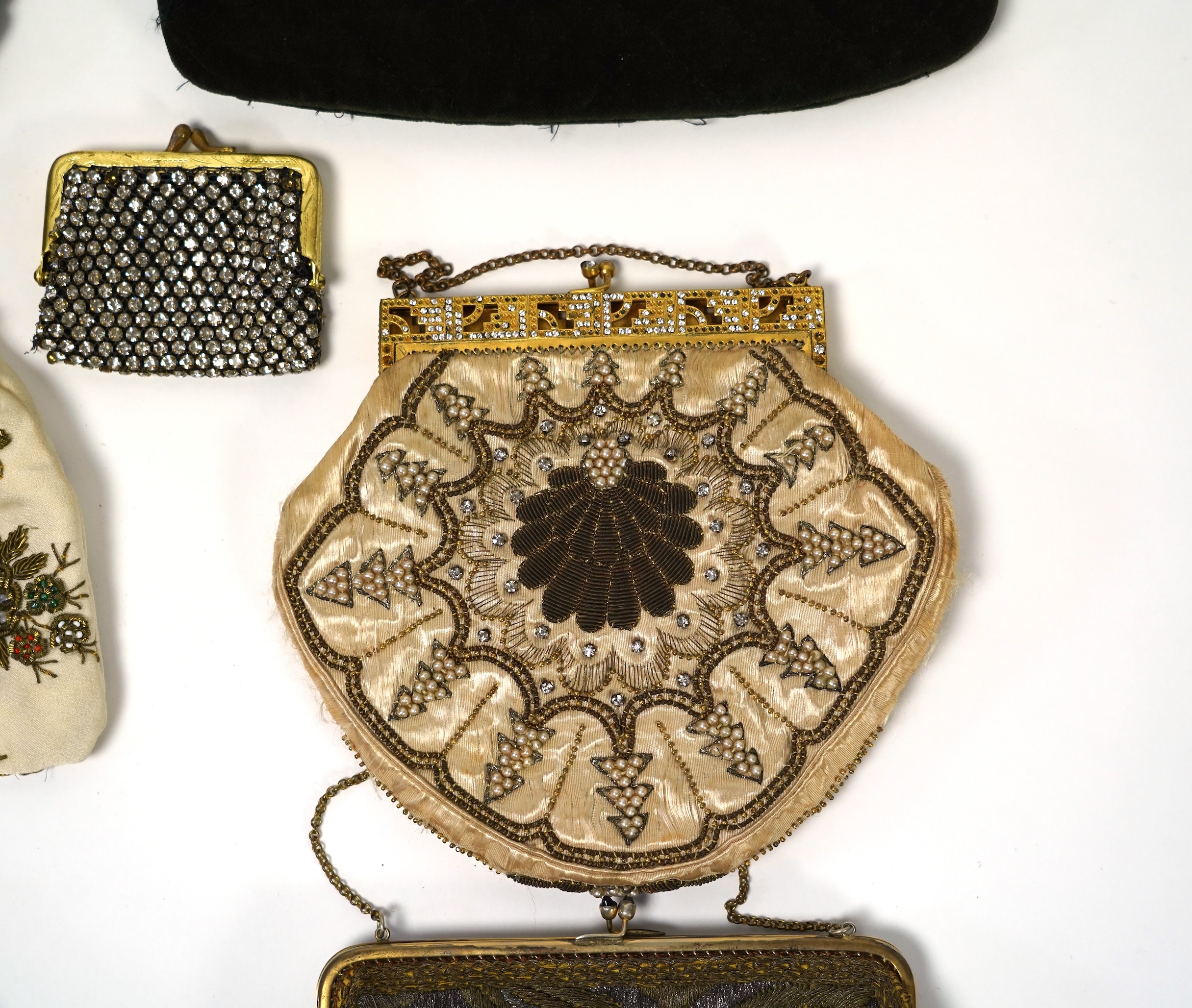 Mixed evening bags; including a 19th century velvet and cut steel handbag, a similar bag, three later gold metallic embroidered evening bags, a mixed metalic evening bag and a diamonte bag and purse (8)